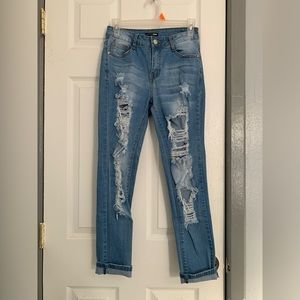 Light wash skinny jeans with slit on the back